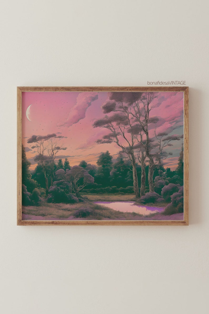 May include: A framed print of a landscape painting with a pink and purple sky, a crescent moon, and a small lake in the foreground. The trees are silhouetted against the sky.