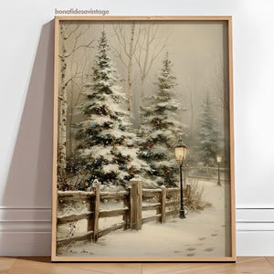 May include: A framed winter landscape painting featuring snow-covered evergreen trees, a wooden fence, and a lamppost. The artwork has a vintage aesthetic, with a soft color palette of whites, browns, and greens. The scene evokes a sense of tranquility and the holiday season.