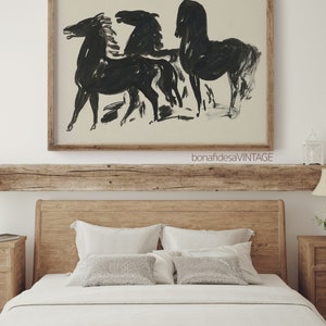 May include: A framed black and white line drawing of three horses in a minimalist style. The drawing is on a cream background and is framed in a natural wood frame. The frame has the text "bonafidesaVINTAGE" printed on the bottom.