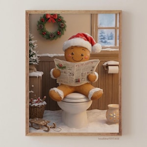 Pode incluir: Impressão emoldurada de um homem de gengibre usando um gorro de Papai Noel, sentado em um vaso sanitário e lendo um jornal. Uma coroa de Natal e uma pequena árvore de Natal são visíveis ao fundo. A cena se passa em um banheiro com neve.