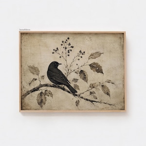 Peut inclure: Une impression d'art encadr&eacute;e rectangulaire repr&eacute;sentant un oiseau noir perch&eacute; sur une branche avec des feuilles et de petites baies. L'&oelig;uvre pr&eacute;sente un fond textur&eacute; beige et brun avec le texte bonafidesa imprim&eacute; dans le coin sup&eacute;rieur gauche.