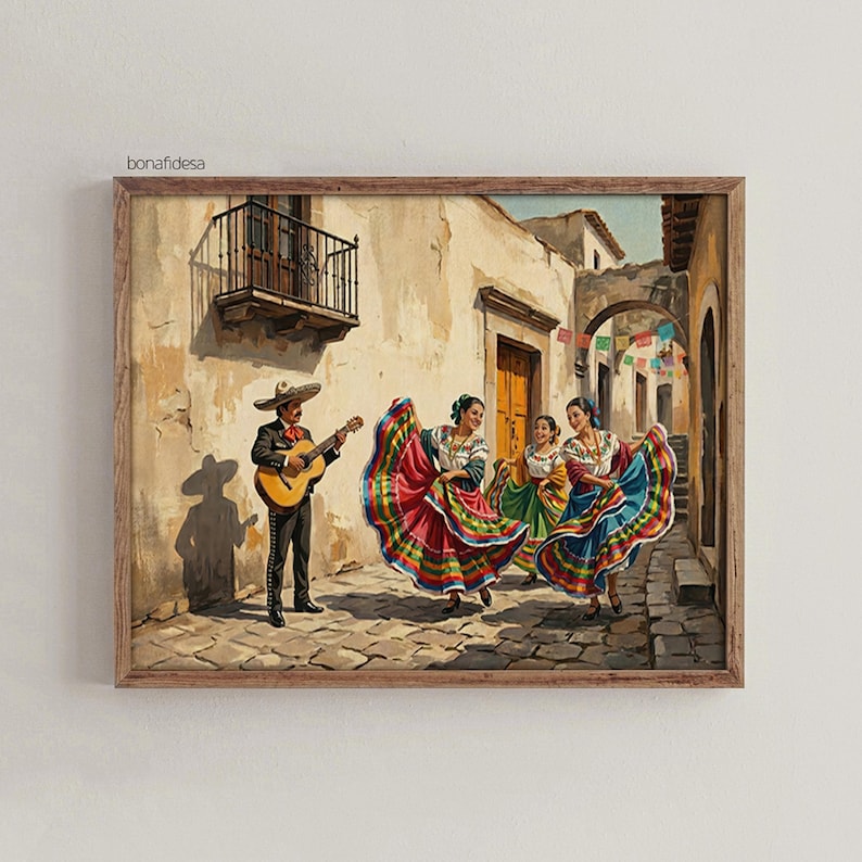 May include: A framed wall art print depicting a musician playing an acoustic guitar while three dancers in colorful, multi-layered skirts perform on a cobblestone street. The scene features beige stucco buildings, a balcony, and hanging banners.