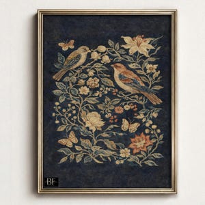 May include: Framed wall art featuring a vintage-style illustration. Two birds perch on flowering branches with butterflies, set against a dark blue background. The artwork is enclosed in a gold-colored frame, adding a touch of elegance.