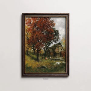 Könnte beinhalten: Gerahmtes Vintage-Landschaftsgemälde mit einem rustikalen Bauernhaus inmitten von Bäumen mit leuchtendem Herbstlaub. Das Kunstwerk zeigt eine ruhige Landschaftsszene mit warmen, erdigen Tönen und einem dunkelbraunen Rahmen.