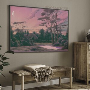 May include: A framed print of a landscape painting with a crescent moon in the sky. The painting features a forest with trees and a pond in the foreground. The sky is a soft pink and purple color.