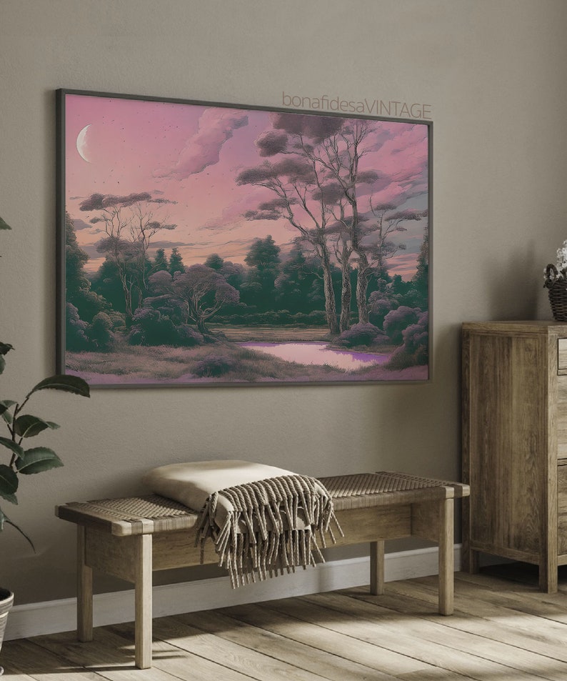 May include: A framed print of a landscape painting with a crescent moon in the sky. The painting features a forest with trees and a pond in the foreground. The sky is a soft pink and purple color.
