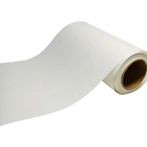 May include: A roll of white, opaque, self-adhesive vinyl. The vinyl is rolled up on a cardboard core.
