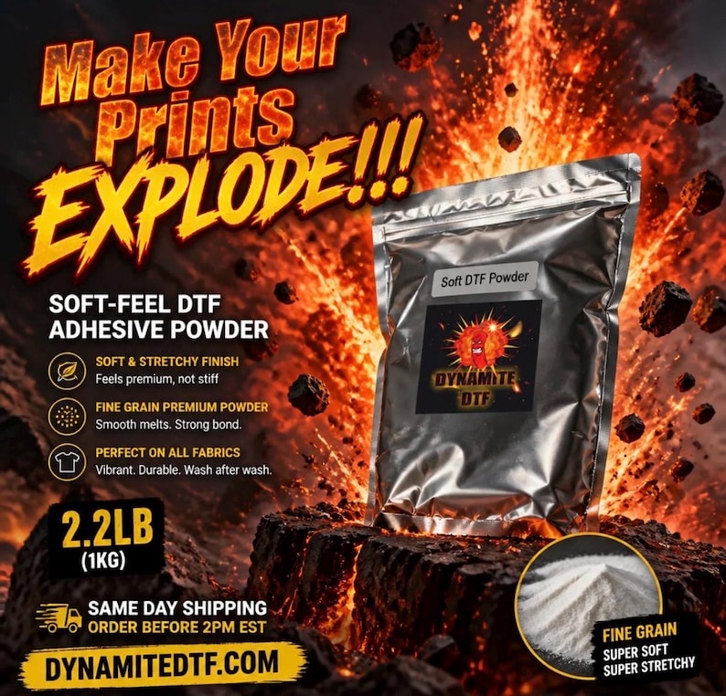 May include: A silver metallic pouch of soft-feel DTF adhesive powder weighing 2.2LB. The label features the text Soft DTF Powder and Dynamite DTF with a graphic of a burning stick of dynamite. A small circular inset shows the fine white powder.