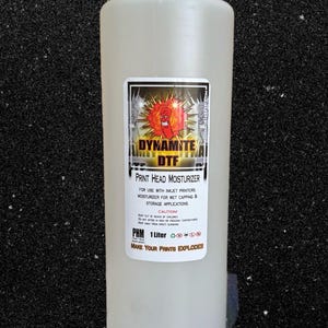 May include: A clear plastic bottle with a white cap and a label that says "Dynamite DTF Print Head Moisturizer". The label also says "For use with inkjet printers. Moisturizer for wet capping & storage applications. Caution: Keep out of reach of children. Do not store in freezing temperatures. Keep away from direct sunshine. PHM 1 Liter. Make your prints explode!!"