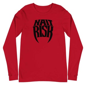 May include: Red long-sleeve t-shirt with a black graphic of the text "WAIT RISK" in a stylized font.