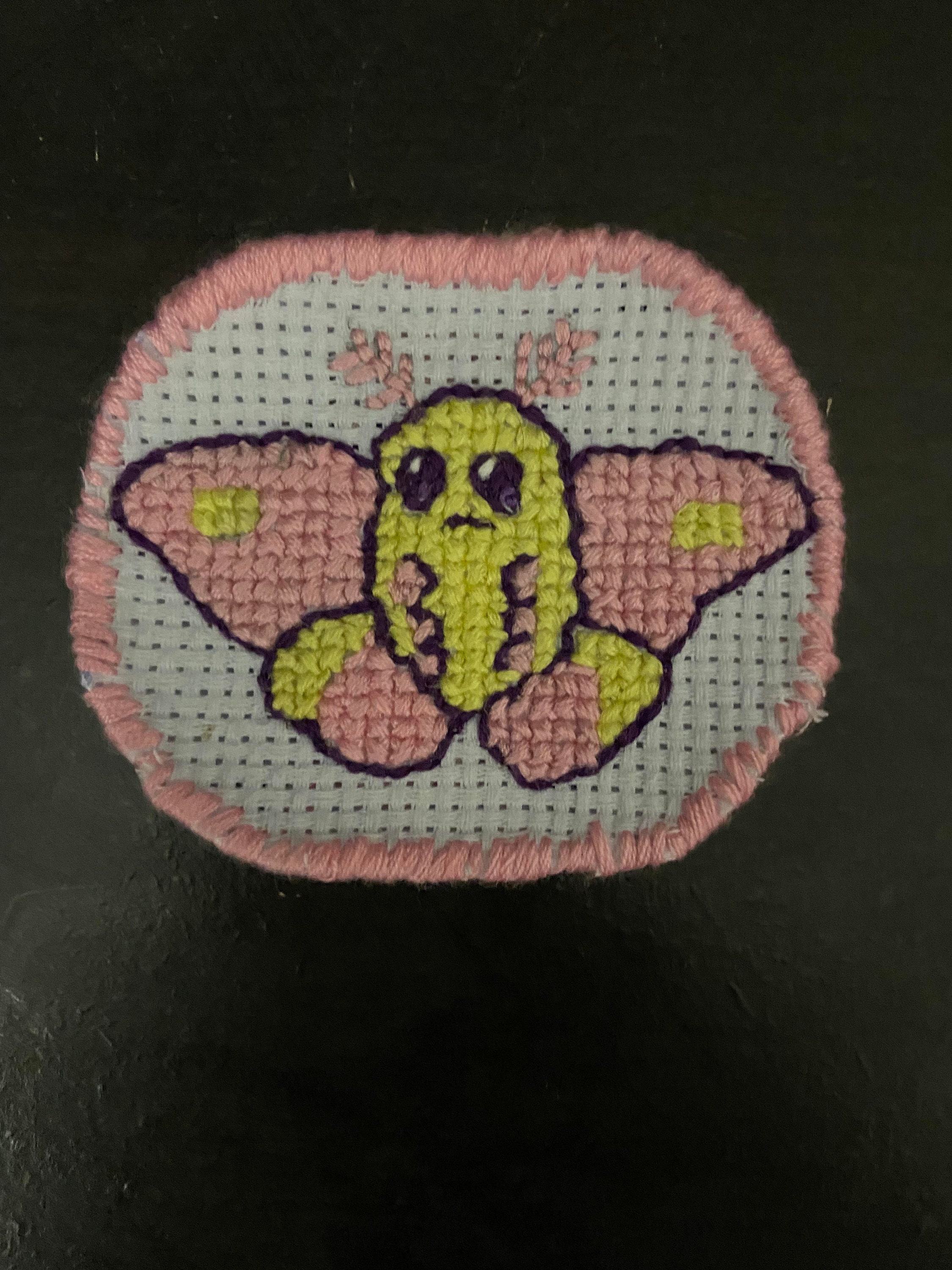 Cross stitched Rosy Maple Moth