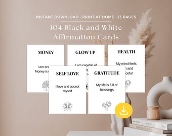 Puede incluir: Un conjunto de 104 tarjetas de afirmación en blanco y negro con diferentes categorías, que incluyen dinero, crecimiento personal, amor propio, gratitud y salud. Cada tarjeta presenta un simple dibujo de línea y una afirmación.