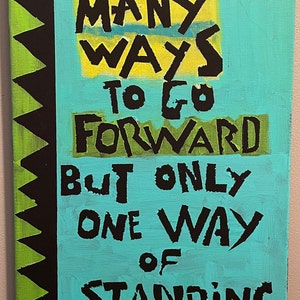 May include: A turquoise blue canvas with black text that reads "There are many ways to go forward but only one way of standing still. -FDR." The background is a black and green pattern.