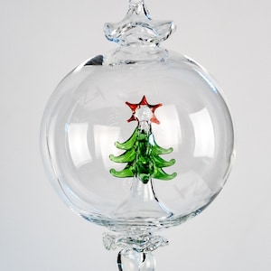 Hand made hand blown and Hand Painted Christmas ornament with inner Christmas tree
