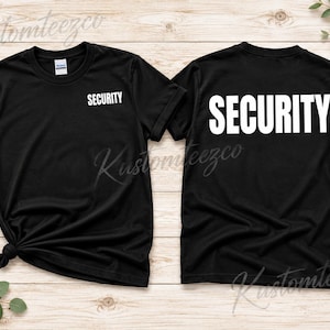 May include: A black short-sleeve t-shirt featuring the word SECURITY printed in white on the left chest and in a larger white font across the back. The shirt has a crew neckline and is displayed in both front and back views.