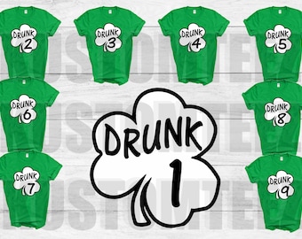 Puede incluir: Camisetas verdes con la palabra "DRUNK" dentro de un trébol blanco, numeradas del 2 al 9. También se muestra un trébol grande con "DRUNK 1". Estas camisetas son probablemente para el Día de San Patricio.