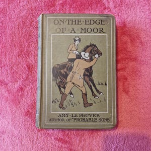 Antique book. On The Edge Of A Moor by Amy Le Feuvre. Published 1920&#39;s. London R.T.S. Amy Le Feuvre, Author of &#39;Probable Sons&#39;