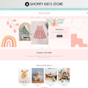 May include: A website homepage for a children's clothing and toy store called "Wonderland". The homepage features a pink dress, a baby crib, and a selection of stuffed animals. The text "New Collection" is displayed on the page.
