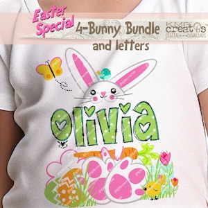 May include: A white t-shirt with a green and white bunny with pink ears and a green and white name "Olivia" with hearts. The bunny is holding a carrot and there are Easter eggs and a chick in the grass.