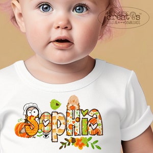 May include: A white baby onesie with a Thanksgiving-themed design featuring a turkey, pumpkins, and the name "Sophia".