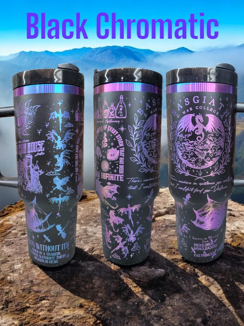 May include: Three black stainless steel travel mugs with a holographic finish. The mugs feature a variety of designs including dragons, a house, and a storm. The text on the mugs reads "Apothecary", "The Eye of Every Storm That Has Been", "Basgiath War College", "I Have a Thing for Highlords, Wingleaders & Fae Princes", "There's no curse in existence you will find that I wouldn't find for you. Valores", "One Without Its Other Is a Tragedy. One Without Their Dragon Is Dead."