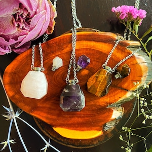 Hand crafted hollow crystal bottle necklace for perfume or essential oil.  Amethyst, Tiger’s Eye, Rose Quartz. (Mini funnel included)