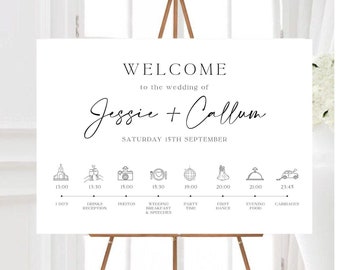 May include: A white wedding welcome sign with black text and icons. The sign lists the wedding schedule for the day, including the ceremony, drinks reception, photos, wedding breakfast and speeches, party time, first dance, evening food, and carriages.