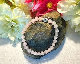 Rose Quartz Bracelet with Awareness Ribbon Charm: A Natural Beauty with a Meaningful Message