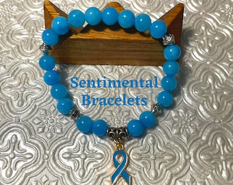 Light Blue Jade Awareness Bracelet with Ribbon Charm