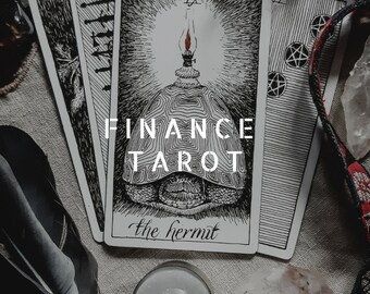 May include: A black and white tarot card with the Hermit card image. The card is part of a Finance Tarot deck. The card has the text "The Hermit" at the bottom.