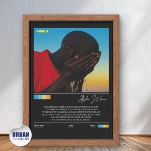 May include: A framed poster with a black and white photo of a person with their face covered by their hands. The poster is titled "Alpha Warn" and has a list of song titles in yellow text on a blue, green, and orange background.