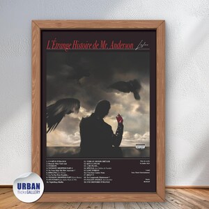 May include: A framed poster with a black background and a silhouette of a person standing in front of a cloudy sky. The poster is titled "L'Étrange Histoire de Mr. Anderson" and features a list of song titles.