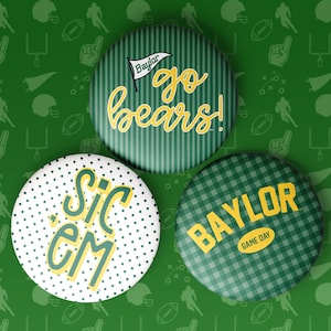 May include: Three circular pinback buttons featuring Baylor University themes. One button has green stripes with the text "go bears!", one has white polka dots with "SIC 'EM" in yellow, and one has a green plaid pattern with "BAYLOR GAME DAY".