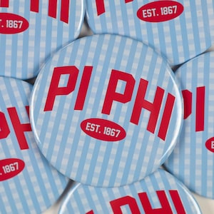 May include: A collection of round buttons with a light blue and white gingham pattern. Each button features the red text "PI PHI" and "EST. 1867" in a red oval.