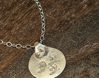 Fine silver pendant, featuring multiple chickadees in flight