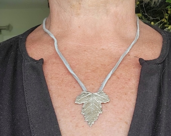 Fine silver maple leaf pendant on a suede cord