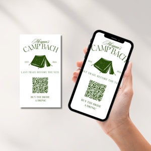 May include: A white card with green text and a green tent graphic. The text reads "Morgan's Camp Bach Est. 2024 Last Trail Before The Veil. Buy The Bride A Drink!" A QR code is below the text.