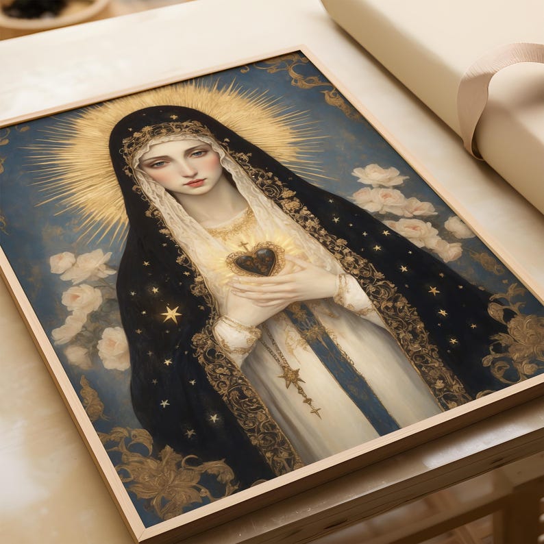 May include: A framed religious artwork featuring a woman in a black veil and gold halo. The woman is holding a heart with a flame. The artwork has a blue background with white roses and gold accents.