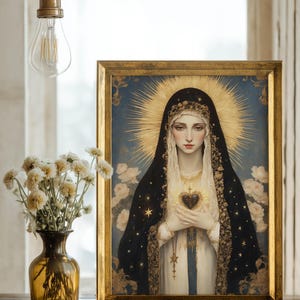 May include: A framed religious portrait depicts a woman in a black veil and gold halo, holding a heart. The artwork is set against a blue background with a gold frame. A vase of white flowers and a light bulb are in the foreground.