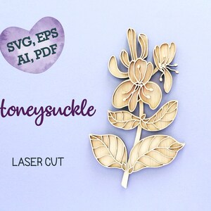 May include: Laser cut wooden honeysuckle flower design. The design is intricate and detailed, with delicate leaves and flowers. The wood is a light brown color. The image includes the text "SVG, EPS, AI, PDF" and "Honeysuckle LASER CUT".