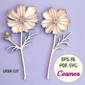 May include: Two laser-cut wooden cosmos flowers with detailed petals and stems, set against a light purple background. One flower is in bud. The image includes the text "LASER CUT" and a circle with "EPS, AI, PDF, SVG" and the word "Cosmos".