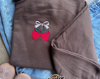 Strawberry with coquette bow embroidered in pocket placement, comfort colors t shirt and unisex Gildan crewneck, strawberry, cute design tee