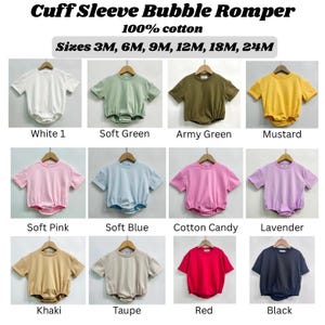 May include: A display of baby rompers in various colors, including white, green, army green, mustard, pink, blue, cotton candy, lavender, khaki, taupe, red, and black. The text "Cuff Sleeve Bubble Romper" and "100% cotton" are at the top, with size options listed below.