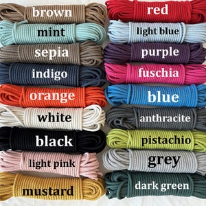 May include: A collection of 18 spools of cotton cord in various colors, including brown, mint, sepia, indigo, red, light blue, purple, fuchsia, orange, blue, white, anthracite, black, pistachio, light pink, grey, mustard, and dark green.