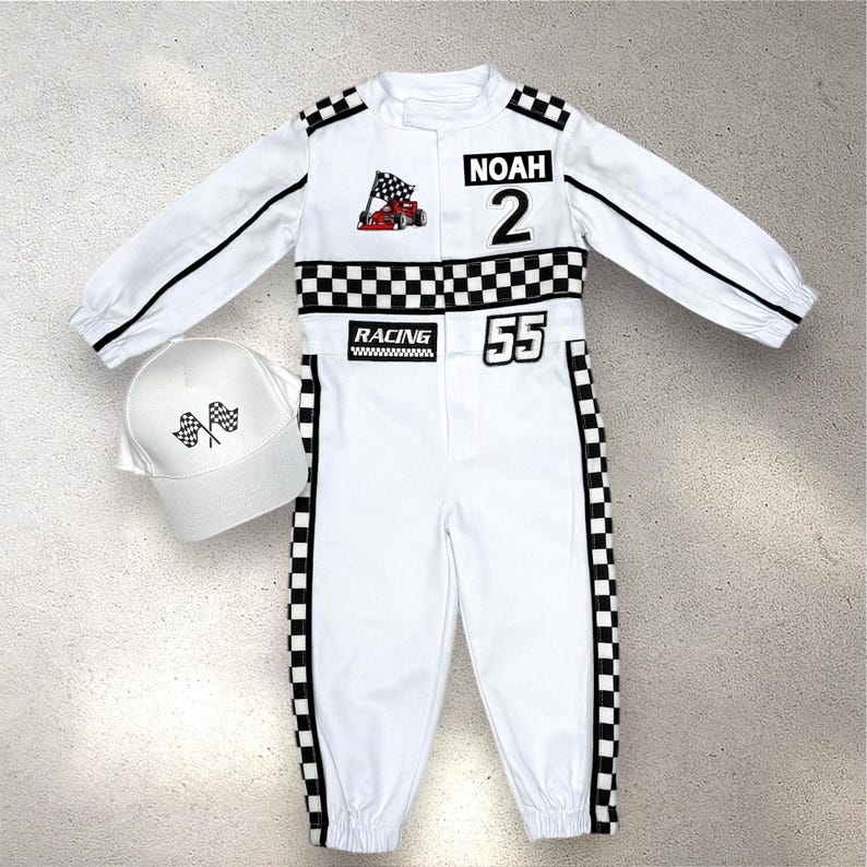May include: White racing jumpsuit with black accents, a checkered flag patch, and the name "NOAH" and the number "2". Includes a matching white cap with checkered flags. The jumpsuit has the number "55" and the word "RACING".