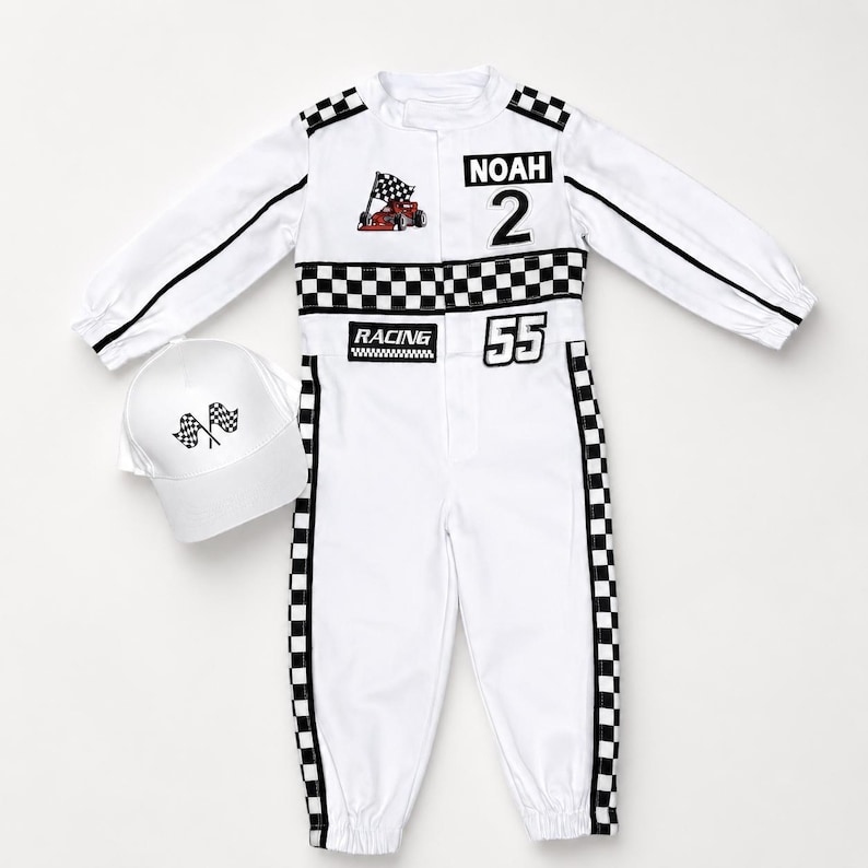 May include: A white long-sleeve racing jumpsuit with black and white checkered trim, featuring the name NOAH, the number 2, the number 55, a red race car graphic, and the word RACING. A matching white baseball cap with two checkered flags.