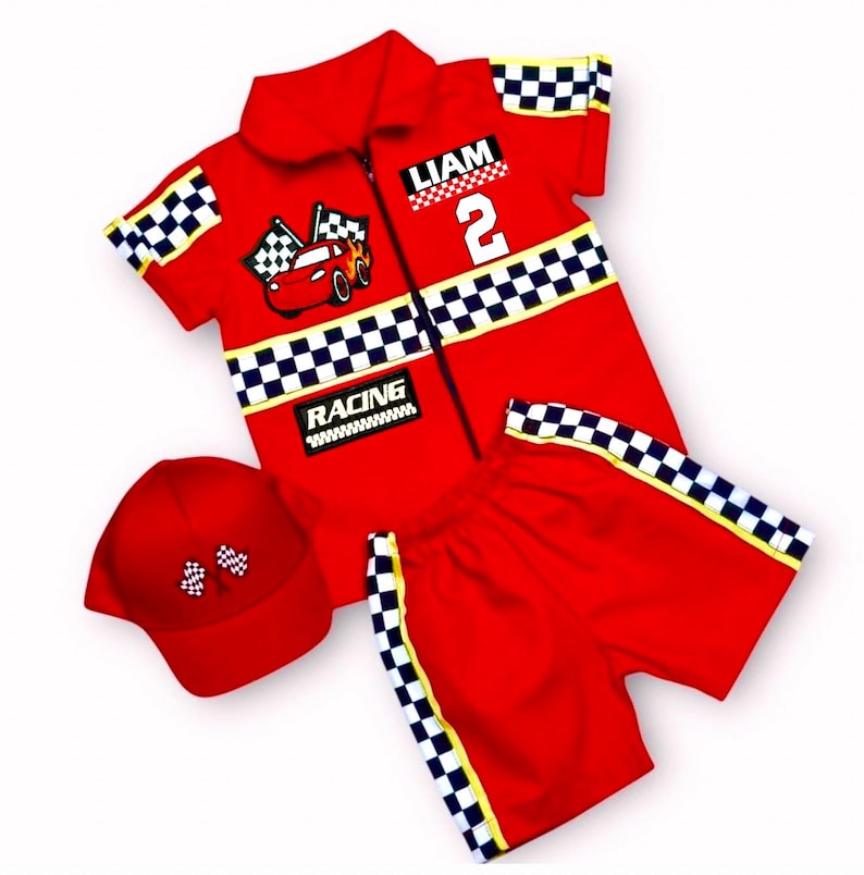 May include: A red short-sleeved zip-up shirt, matching shorts, and a baseball cap. The shirt features a checkered pattern, a race car graphic, the name LIAM, the number 2, and the word RACING. The shorts and cap also feature checkered accents.