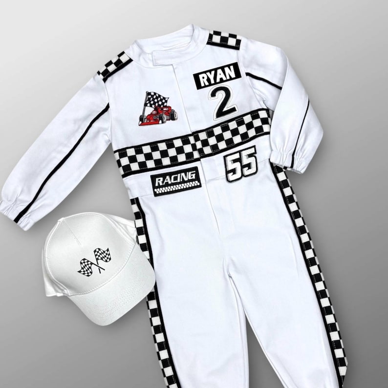 May include: White racing jumpsuit with black and white checkered accents, black stripes, and the name "RYAN" and number "2". Includes a matching white baseball cap with checkered flags. The jumpsuit has the number "55" and the word "RACING".