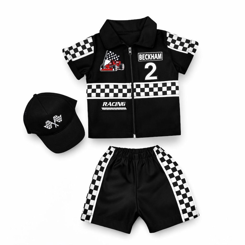 May include: A black short-sleeve zip-up shirt with a checkered pattern, a red race car graphic, the text BECKHAM 2 and RACING, matching black shorts with checkered side panels, and a black baseball cap featuring a white checkered flag graphic.