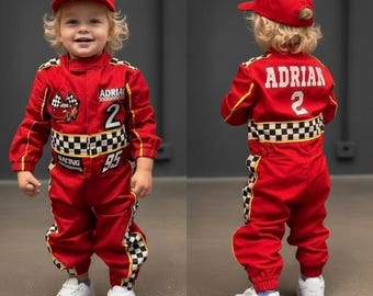 May include: A red racing jumpsuit and matching cap featuring a black and white checkered pattern, the name ADRIAN, the number 2, and a graphic of a red car with checkered flags. The jumpsuit includes white sneakers and long sleeves with cuffs.